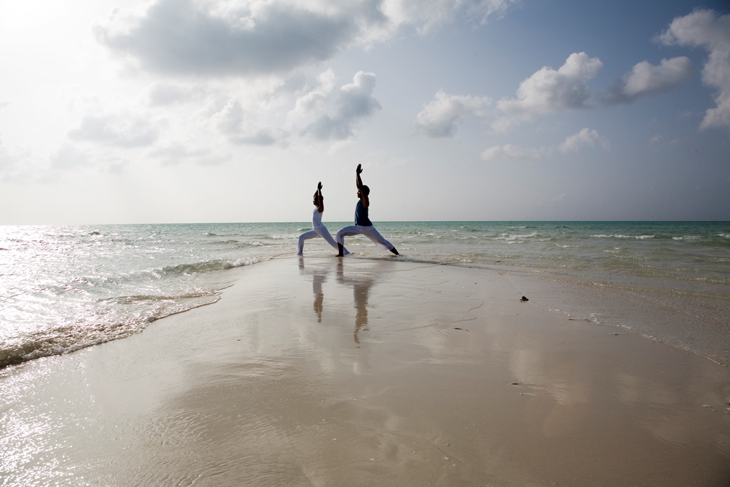 055026_44119140_Yoga_by_the_beach-1