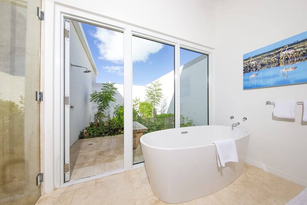 8.-2-bedroom-beachfront-villa-deluxe-bathroom-outdoor-shower-garden