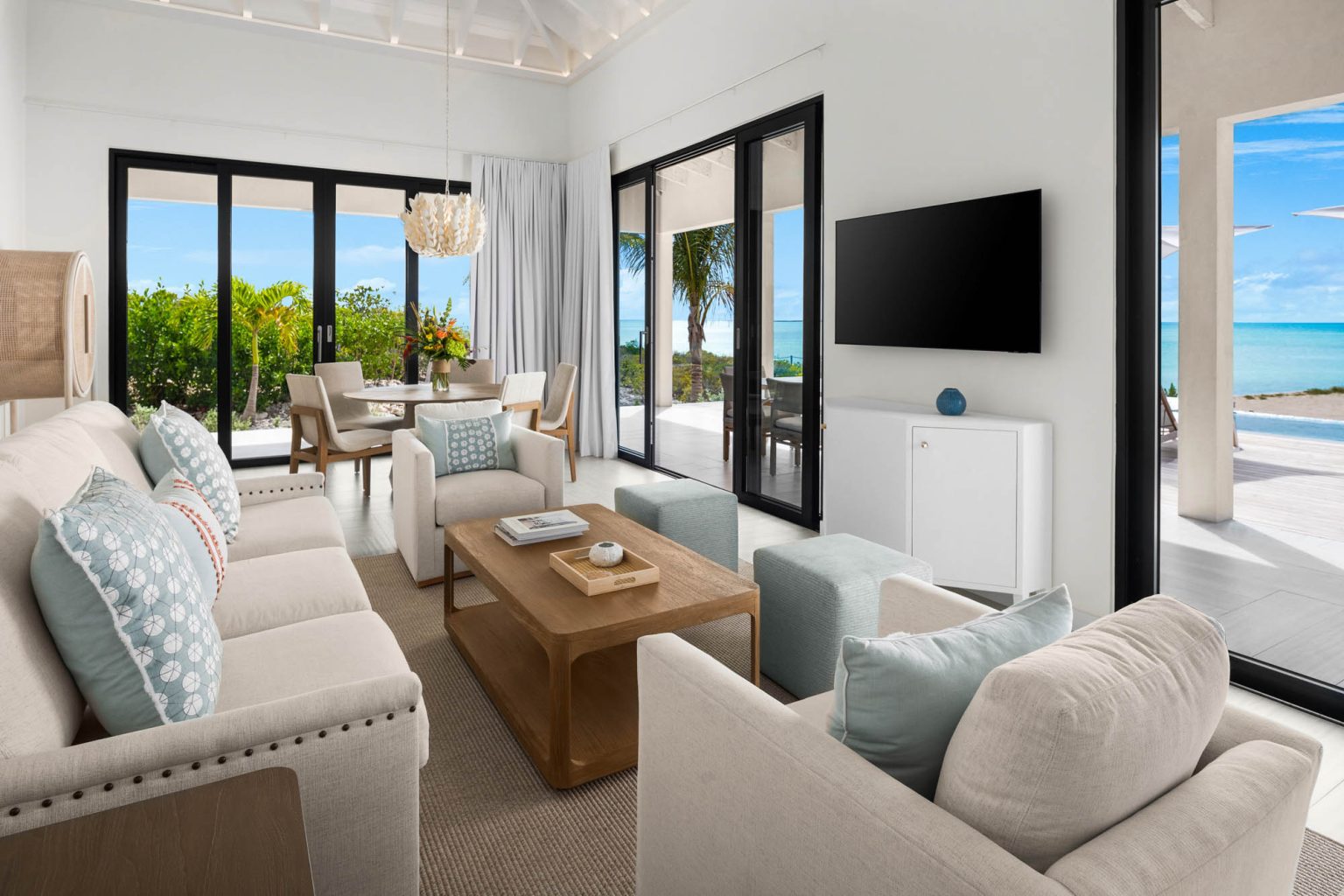 6633aa77189ee2167e312e63_07-ambergris-cay-sunsetpoint-2-bedroom-bungalow-living-dining-room-3000px
