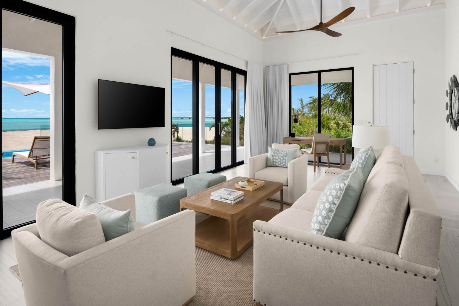 6633aa788bdde7e415886143_06-ambergris-cay-sunsetpoint-2-bedroom-bungalow-living-room-3000px