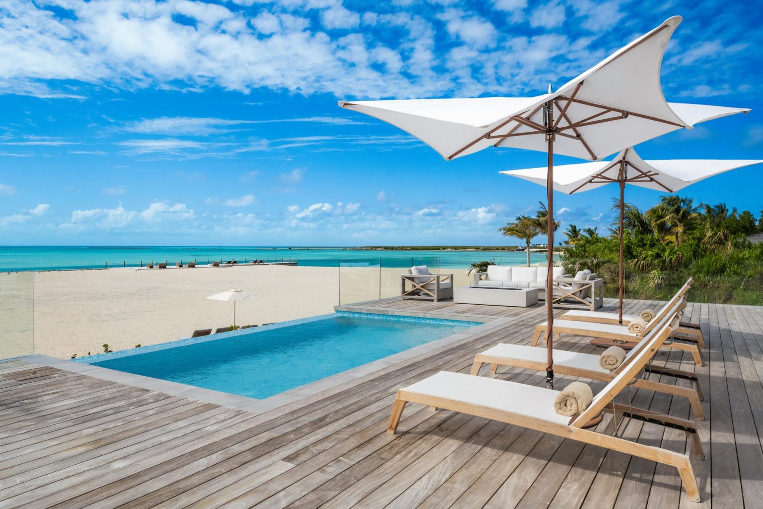 6633b1a7f315e66d052d34d1_ambergris-cay-sunsetpoint-2-bedroom-bungalow-pool-beach-view-3000px