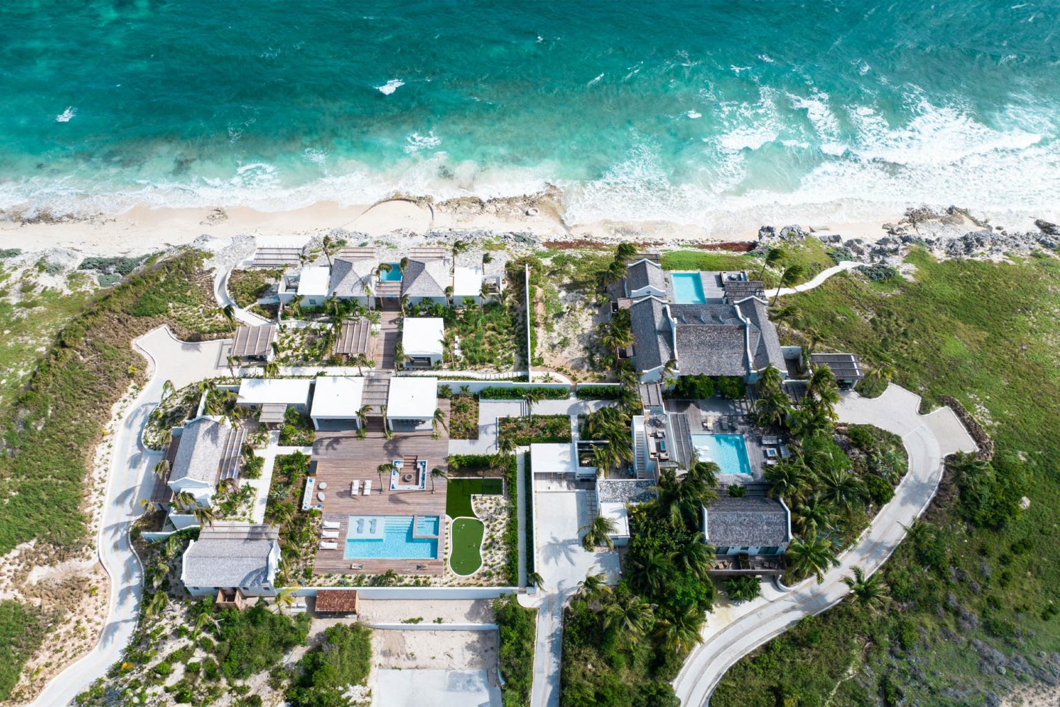 678054bf8737c48c9bca52d9_01-Ambergris-Cay-Dream-Estate-Luxury-Oceanfront-Villas-with-Private-Beach-Aerial-Turks-Caicos