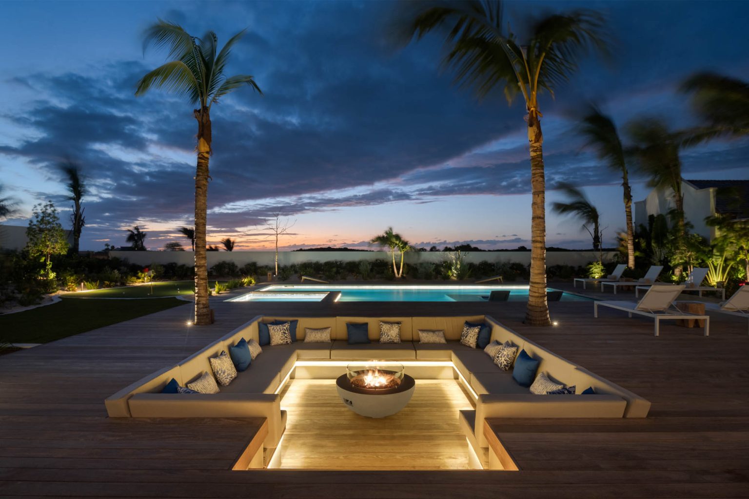 67805a0c07dd71a37566775d_Ambergris-Cay-Dream-Away-Luxury-Villa-Pool-Deck-Firepit-Turks-and-Caicos-Night-view