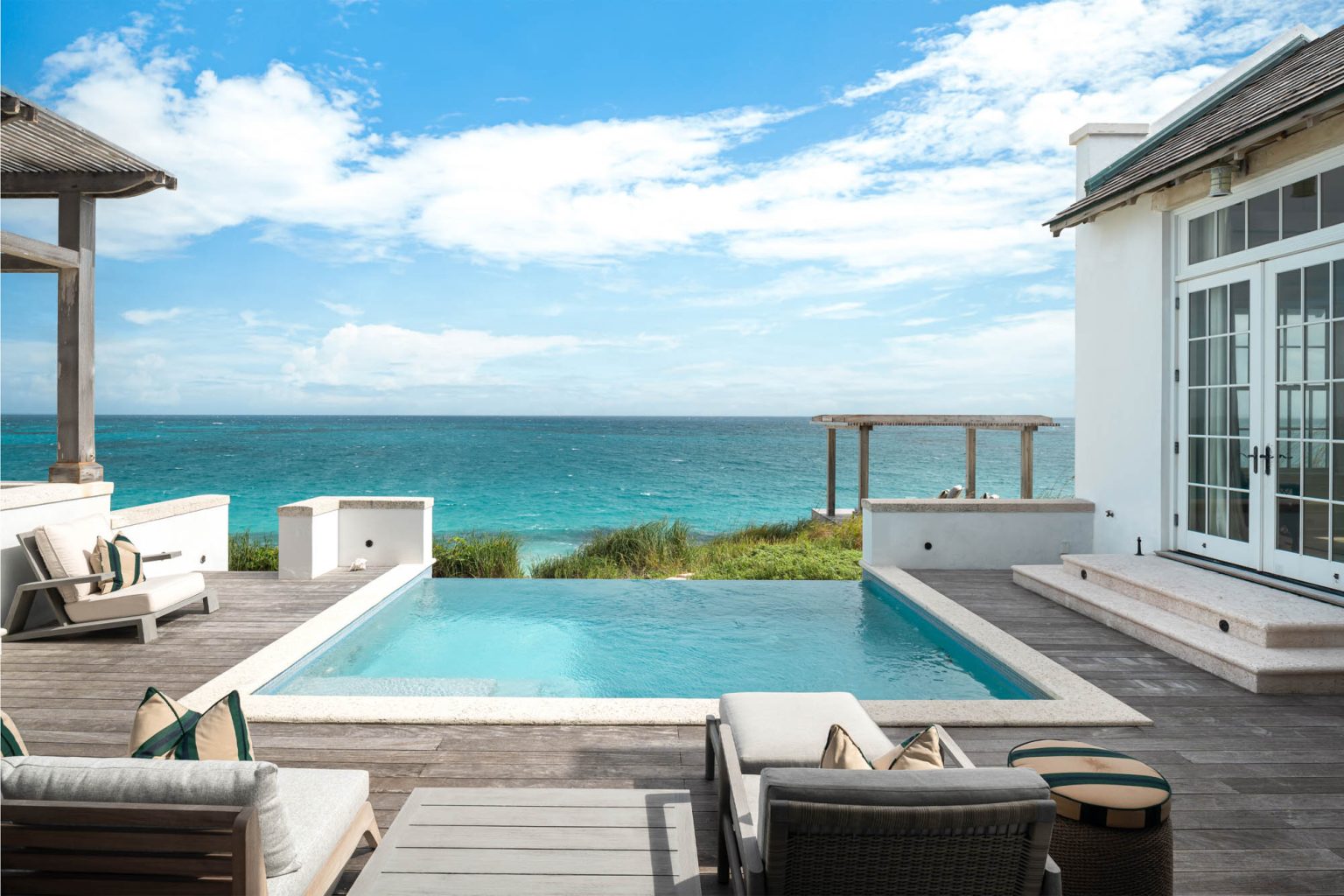 678ae093817f884c6081114a_06 - Ambergris-Cay-Osprey-4-bedroom-villa-pool-with-ocean-view-Turks-and-Caicos