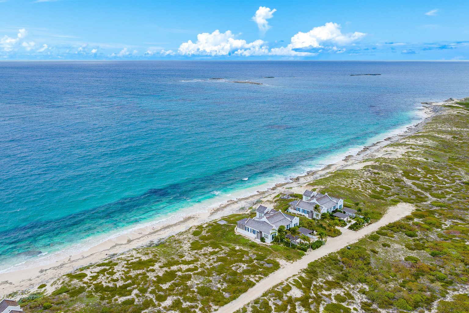 678ae093ae69bb3cdf5c84ff_09 - Ambergris-Cay-Osprey-4-bedroom-villa-Columbus-Beach-aerial--Turks-and-Caicos
