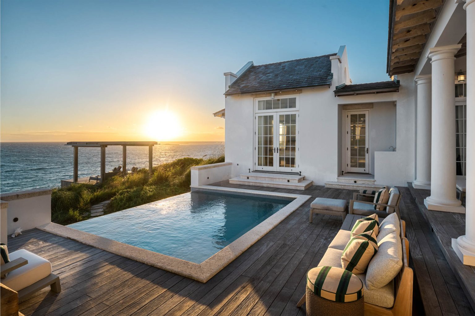 678ae2b0503a8eb6c51b9a06_Ambergris-Cay-Osprey-4-bedroom-villa-pool-deck-at-sunrise-Turks-and-Caicos