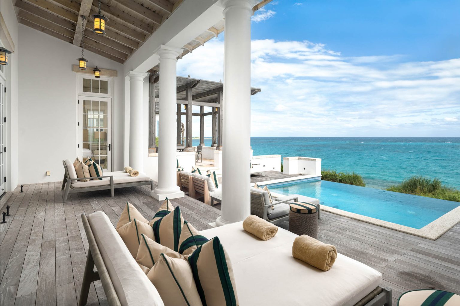 678ae2b08ad98a542790f91b_Ambergris-Cay-Osprey-4-bedroom-villa-pool-deck-ocean-view-Turks-and-Caicos