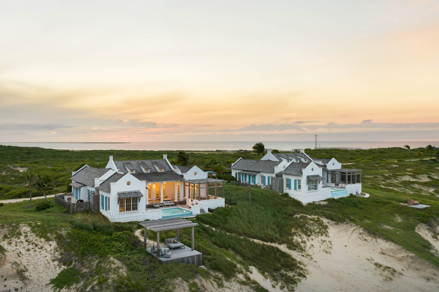 678ae2b0a8986282f91efa06_Ambergris-Cay-Osprey-4-bedroom-villa-aerial-dusk