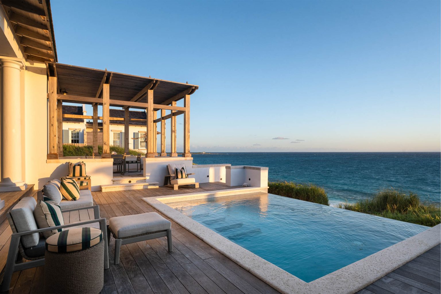 678ae2b0f8a9012c02e48154_Ambergris-Cay-Osprey-4-bedroom-villa-pool-deck-ocean-view-at-dusk