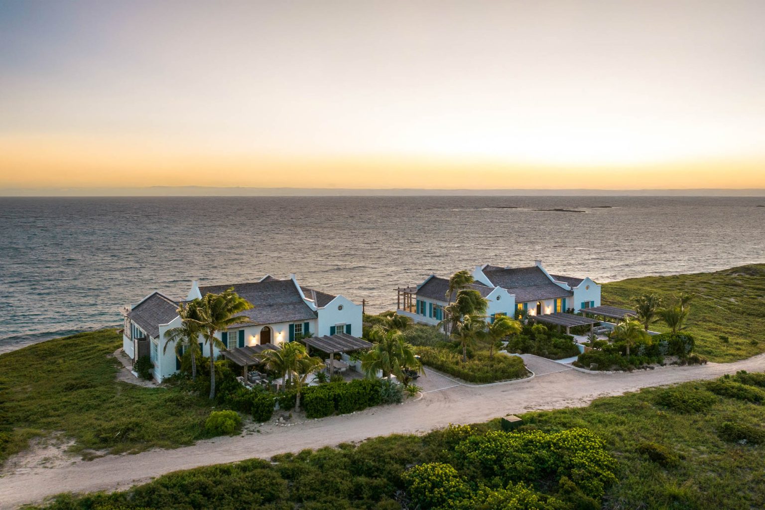 678ae2b0f8c54c43f7d61787_Ambergris-Cay-Osprey-4-bedroom-villa-aerial-at-sunrise