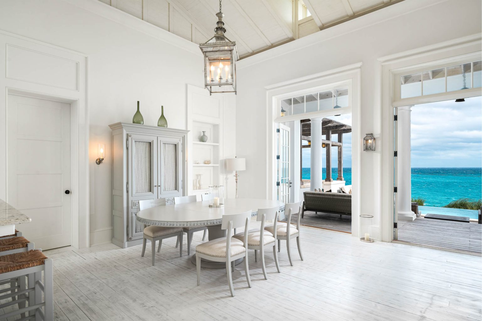678ae2b13e6a89b869f069ca_Ambergris-Cay-Osprey-4-bedroom-villa-dining-area-Turks-and-Caicos