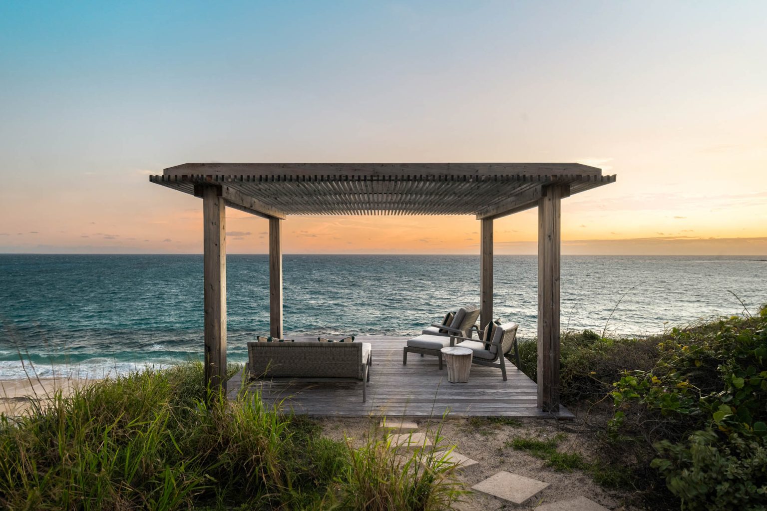 678ae2b1f8c54c43f7d629d8_Ambergris-Cay-Osprey-4-bedroom-villa-sundeck-at-sunrise