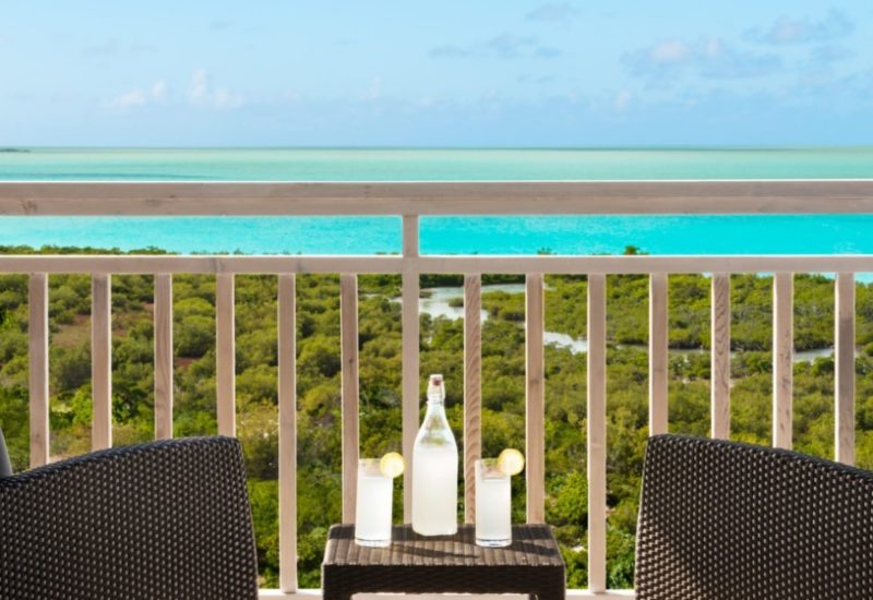 13.1-Sailrock-Resort-Ridgetop-Suite-Wrap-Around-Terrace-West-Coast-Sunset-View-1-1150x560